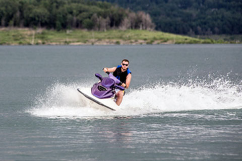 man riding jet ski