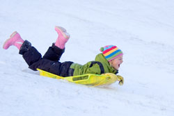 girl sledding